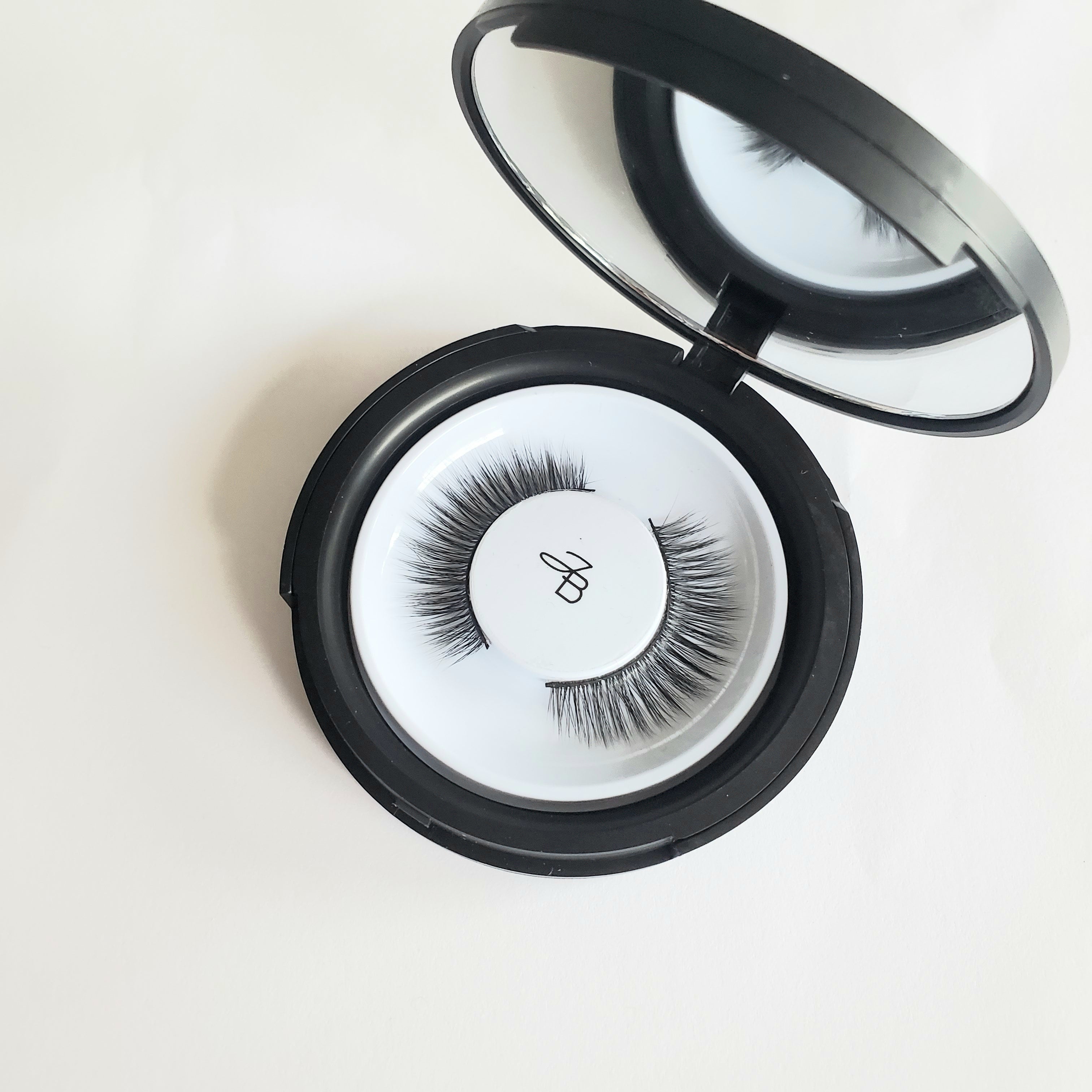 Luxury vegan natural looking lashes in a mirrored compact 